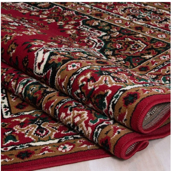 Shotta Traditional Style 5x8 Red Area Rug Roll of patterned red and brown fabric