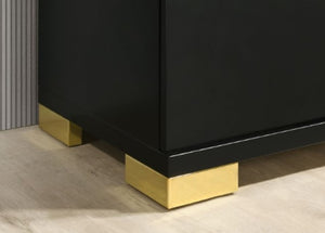 Shysko Black Gold Contemporary Style Dresser Close-up of a black furniture piece with polished gold metal block feet on a light wood floor.