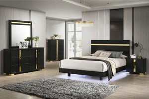 Shysko Black Gold Contemporary Style Dresser A modern bedroom furniture set featuring a black bed frame with gold trim, a matching black nightstand, a black dresser with a mirror, and a black chest, all styled in a contemporary bedroom with gray walls and wood flooring.