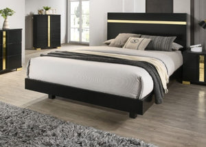 Shysko Black Gold LED Contemporary Style Bed A modern black platform bed with a gold accent stripe on the headboard, styled in a contemporary bedroom with gray and white bedding, flanked by matching black nightstands and a dresser with gold accents.