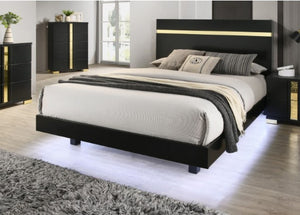 Shysko Black Gold LED Contemporary Style Bed A modern black platform bed frame with a sleek headboard featuring gold accent stripes, styled with neutral bedding in a contemporary bedroom setting.