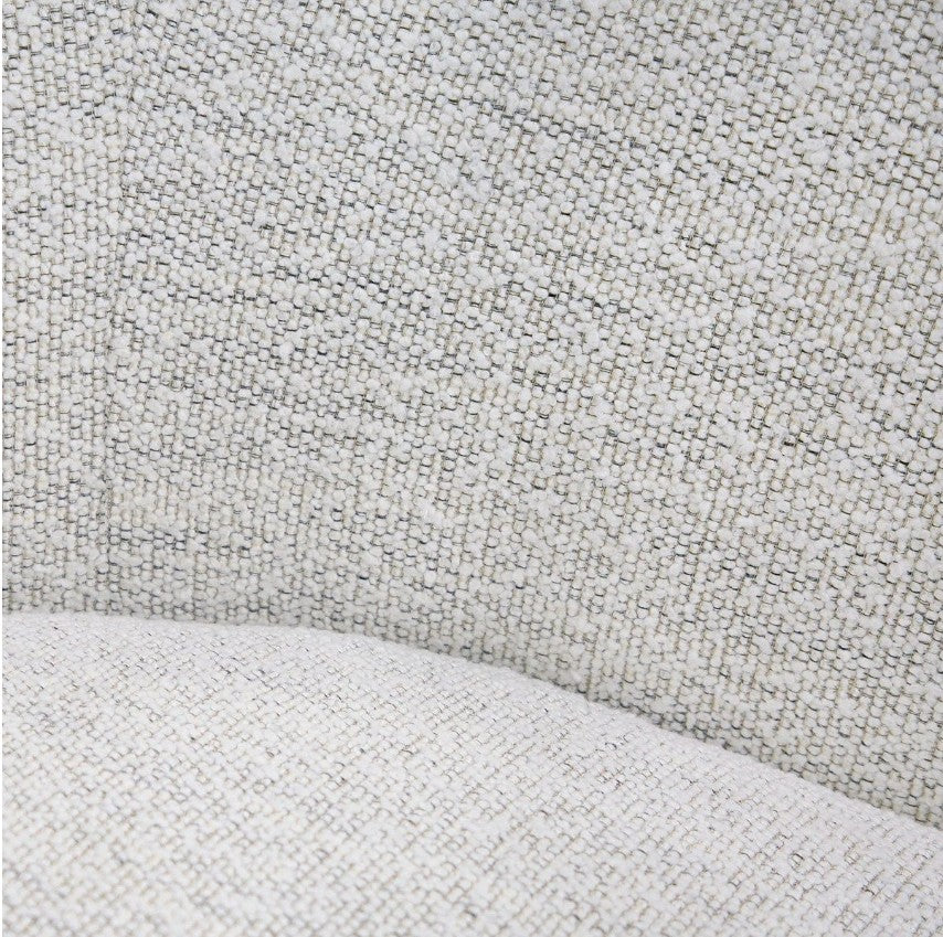 Silvi Off White Modern Fabric Sofa Modern beige sofa in a minimalistic living room with a large window.