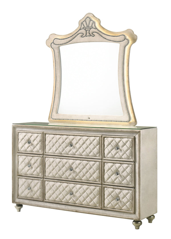 Sonya Beige Velvet Upholstered Traditional Style Dresser A silver and gold dresser with nine diamond-quilted drawers and an attached arched mirror, shown on a plain white background.