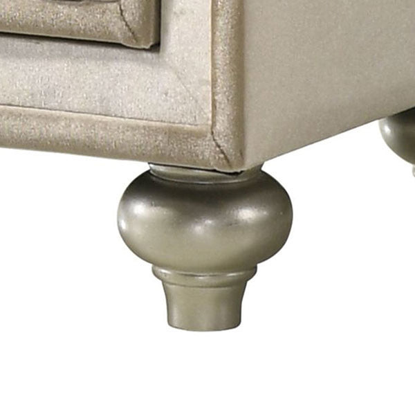 Sonya Beige Velvet Upholstered Traditional Style Nightstand Close-up of a furniture leg on a piece of furniture with a beige finish.