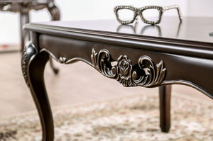 Spencer Solid Wood Traditional Coffee Table Decorative table with ornate legs and a pair of glasses on top