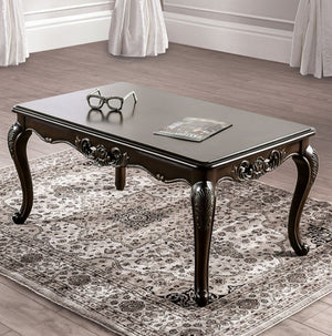 Spencer Solid Wood Traditional Coffee Table Decorative dark wood coffee table with ornate legs on a patterned rug.