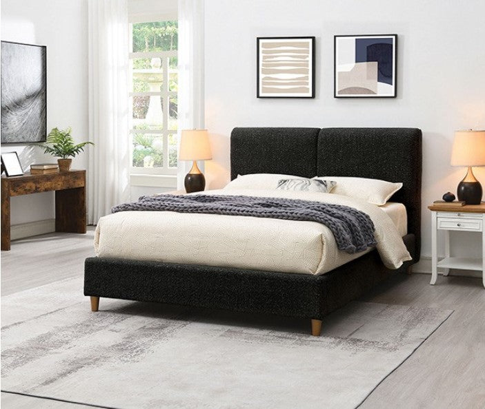 Doira Modern  Style Upholstered Bed Black Finish Black upholstered bed with white bedding and gray blanket in a bedroom setting.