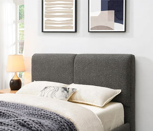 Stivan Bed Fully Upholstered Gray Boucle Fabric Gray upholstered bed with white bedding in a bedroom setting