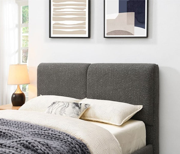 Stivan Bed Fully Upholstered Gray Boucle Fabric Gray upholstered bed with white bedding in a bedroom setting