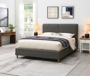 Stivan Bed Fully Upholstered Gray Boucle Fabric Gray upholstered bed in a bedroom with decor elements.