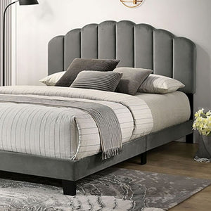 Stringer Fully Upholstered Channel Tufting Bed Gray upholstered bed with striped bedding in a bedroom setting