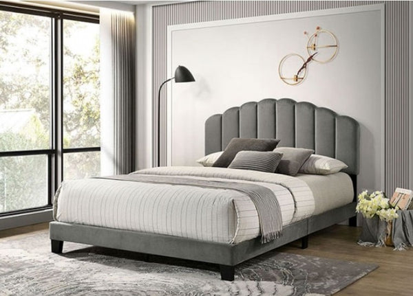 Stringer Fully Upholstered Channel Tufting Bed Gray upholstered bed in a modern bedroom with large windows.