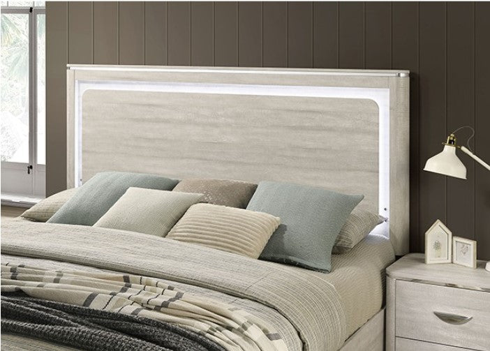 Sundy Curved Edge Dusty Gray Bed Neatly arranged bedroom with wooden furniture including a bed, dressers, and nightstands.