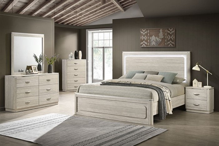 Sundy Curved Edge Dusty Gray Bed Neatly arranged bedroom with wooden furniture including a bed, dressers, and nightstands.