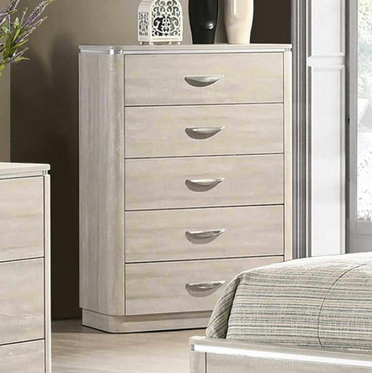 Sundy Curved Edge Dusty Gray Chest Beige dresser with five drawers in a bedroom setting.