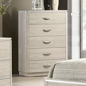 Sundy Curved Edge Dusty Gray Chest Beige dresser with five drawers in a bedroom setting.