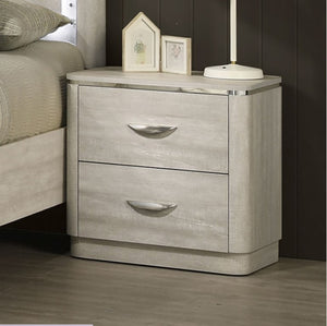 Sundy Curved Edge Dusty Gray Nightstand Gray nightstand with two drawers in a bedroom setting
