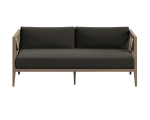 Sunshore Flint Gray Outdoor Loveseat Modern outdoor sofa with dark cushions on a white background
