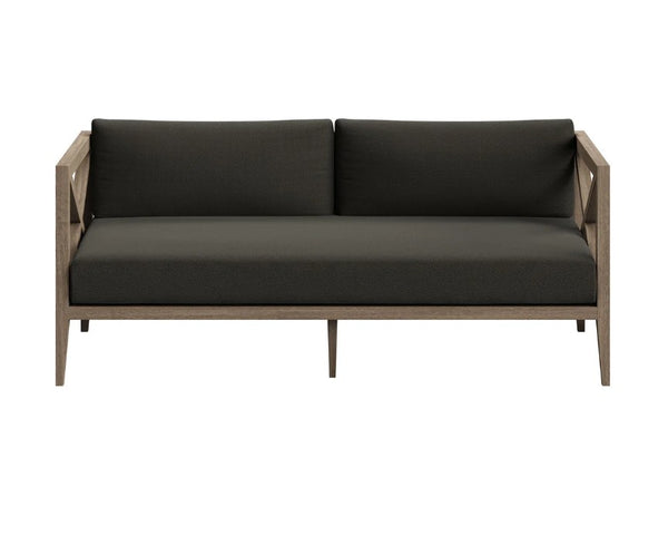 Sunshore Flint Gray Outdoor Loveseat Modern outdoor sofa with dark cushions on a white background