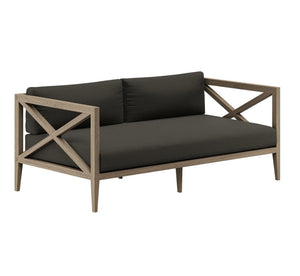 Sunshore Flint Gray Outdoor Loveseat Two-seater outdoor sofa with dark cushions and wooden frame on a white background