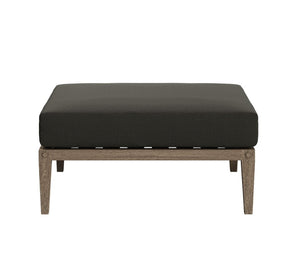 Sunshore Flint Gray Outdoor Ottoman Black cushioned ottoman with wooden legs on a white background