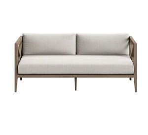 Sunshore Pebble Outdoor Loveseat Modern outdoor sofa with light gray cushions on a white background