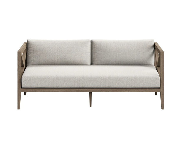 Sunshore Pebble Outdoor Loveseat Modern outdoor sofa with light gray cushions on a white background