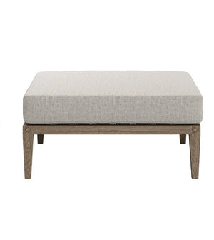 Sunshore Pebble Outdoor Ottoman quare ottoman with a light gray cushion on a white background