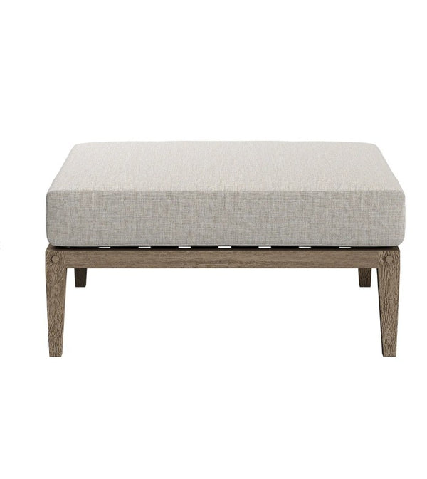 Sunshore Pebble Outdoor Ottoman quare ottoman with a light gray cushion on a white background