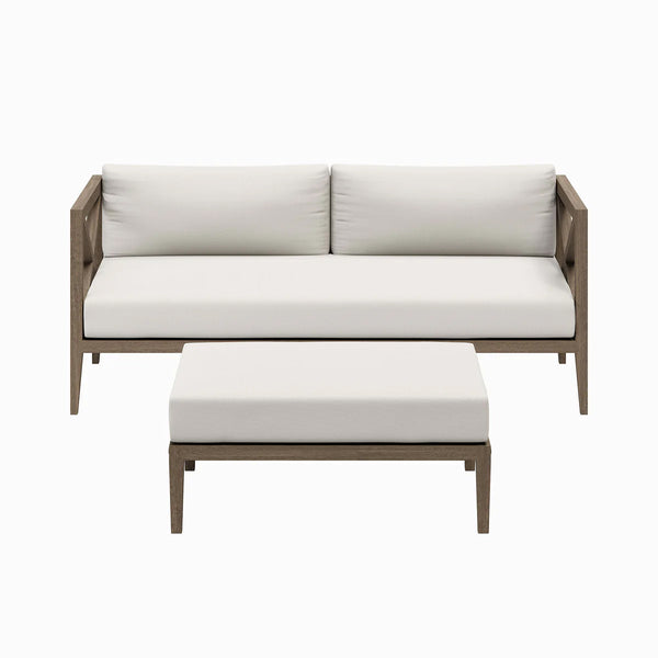 Sunshore Weathered Gray Loveseat and Ottoman Outdoor Set Outdoor sofa set with white cushions and wooden frame on a white background