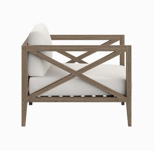 Sunshore Weathered Gray Outdoor Armchair Wooden armchair with white cushions on a white background
