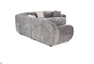 Tiarra Corner Sectional Sofa Fabric Gray A curved gray upholstered sofa with textured fabric, featuring light beige accent pillows, shown on a plain white background.