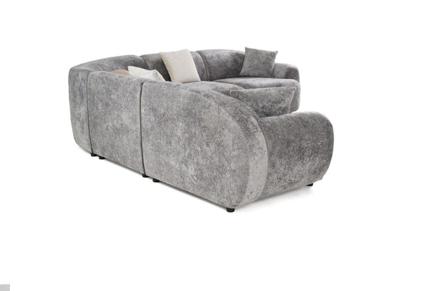 Tiarra Corner Sectional Sofa Fabric Gray A curved gray upholstered sofa with textured fabric, featuring light beige accent pillows, shown on a plain white background.