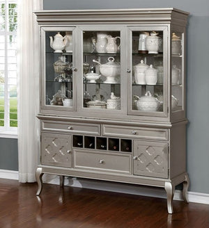 Gray china cabinet with glass doors displaying ceramic items in a room with a window and gray walls.