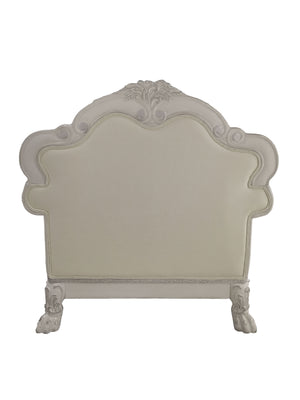 Traditional Style Chair Bone White Dresden Collection An ornate, vintage-style upholstered headboard in a distressed white or off-white finish, featuring carved details on the top and sides and claw-foot legs, shown against a plain white background.