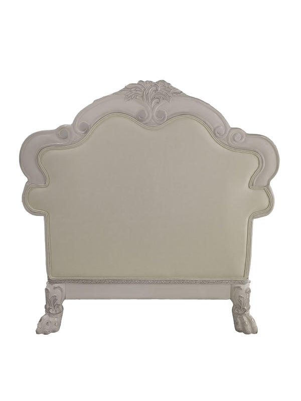 Traditional Style Chair Bone White Dresden Collection An ornate, vintage-style upholstered headboard in a distressed white or off-white finish, featuring carved details on the top and sides and claw-foot legs, shown against a plain white background.
