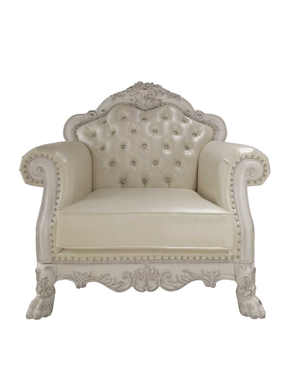 Traditional Style Chair Bone White Dresden Collection An ornate vintage-style armchair with a tufted cream leather seat and backrest, featuring carved white wood detailing and nailhead trim, isolated on a white background.