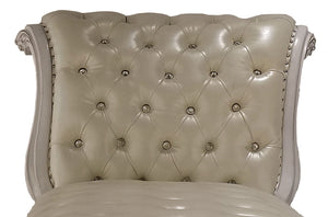 Traditional Style Chaise Bone White Dresden Collection Close-up of a tufted upholstered chair back in warm ivory or cream leather, with decorative nailhead trim and carved side arms visible against a plain white background.