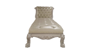 Traditional Style Chaise Bone White Dresden Collection A vintage-style chaise lounge with a tufted cream leather seat and backrest, supported by an ornate carved light wood frame with claw legs, shown against a plain white background.