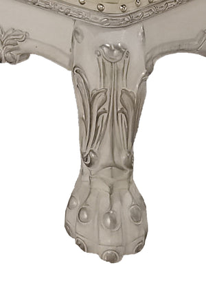 Traditional Style Chaise Bone White Dresden Collection Close-up of an ornate carved table leg in a light gray finish, showing decorative scrollwork and a claw-foot style base on a plain white background.