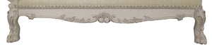 Traditional Style Chaise Bone White Dresden Collection Close-up of an ornate upholstered bench or seat with carved decorative details and carved legs, shown against a plain white background.