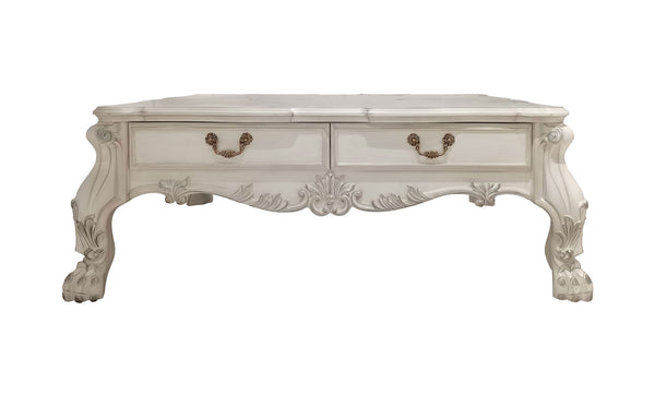 Traditional Style Coffee Table Bone White Dresden Collection An ornate white carved coffee table with two drawers, featuring gold-toned metal handles and decorative cabriole-style legs, shown against a plain white background.
