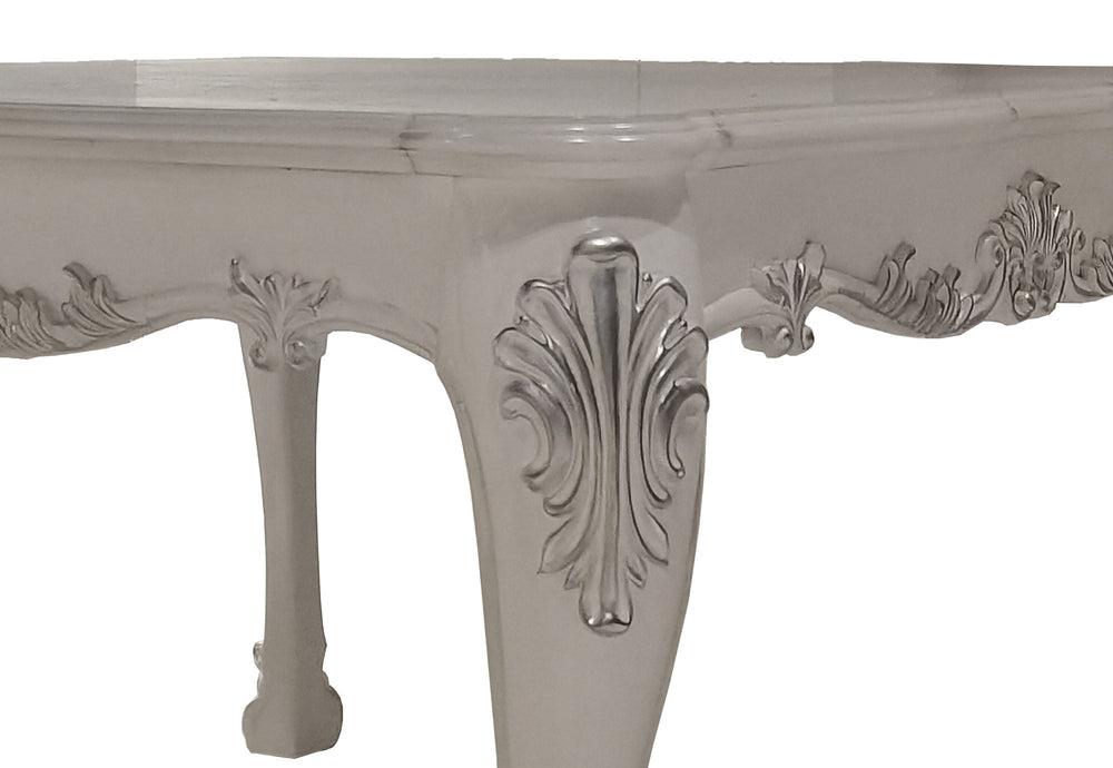 Traditional Style Counter Height Dining Table Bone White Dresden Collection An ornate white carved dining room set with a rectangular table and eight matching upholstered chairs, shown in a luxurious dining room with a crystal chandelier, hutch, and sideboard.