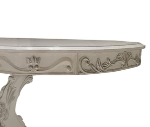 Traditional Style Dining Table Bone White Dresden Collection Close-up of a white carved console table corner showing ornate scrollwork and a cabriole-style leg on a plain white background.