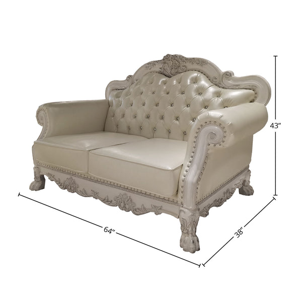 Traditional Style Loveseat Bone White Dresden Collection An ornate cream-colored loveseat sofa with tufted upholstery and carved details, shown with dimension lines indicating measurements of 64 inches wide, 38 inches deep, and 43 inches high on a white background.