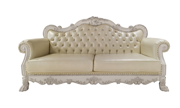 Traditional Style Sofa Bone White Dresden Collection An ornate cream-colored tufted sofa with carved white wood arms and legs, shown against a plain white background.