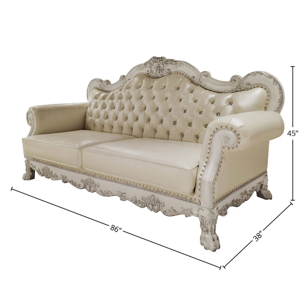 Traditional Style Sofa Bone White Dresden Collection An ornate cream-colored tufted loveseat sofa with carved distressed white wood detailing, shown with dimension lines indicating 86 inches wide, 38 inches deep, and 45 inches high on a white background.