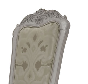 Traditional Style Dining Chair Bone White Dresden Collection Close-up of an ornate upholstered chair back with a carved silver-gray frame and beige damask-patterned fabric insert, shown on a white background.