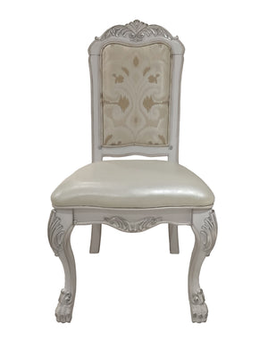 Traditional Style Dining Chair Bone White Dresden Collection An ornate baroque-style dining chair with a carved white wooden frame, a cream upholstered seat, and a patterned beige and cream backrest, shown against a plain white background.