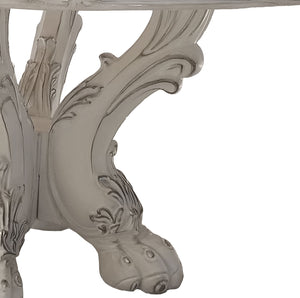 Traditional Style Round Dining Table Bone White Dresden Collection Close-up of an ornate carved table leg in a distressed white finish, showing detailed scrollwork and a clawfoot-style base on a plain white background.
